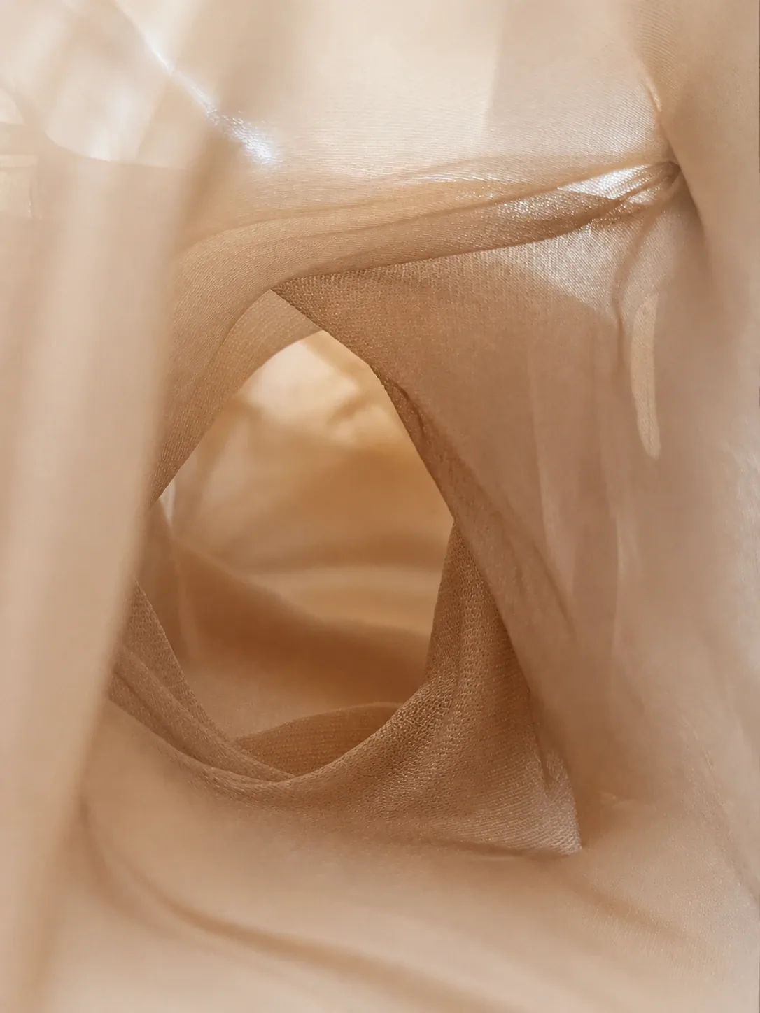 Close detail of BLUR translucent mesh material forming a passage