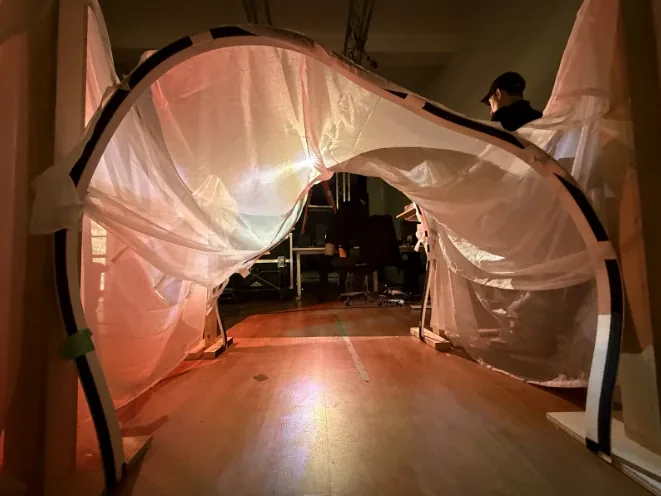 BLUR Montreal prototype passage view with fabric arch and warm projection