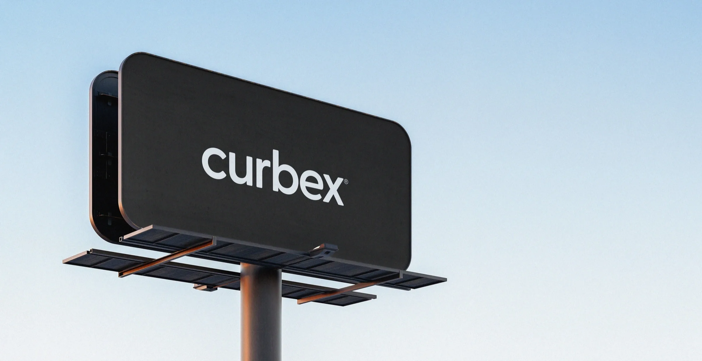 Curbex branded outdoor advertising billboard against a pale blue sky