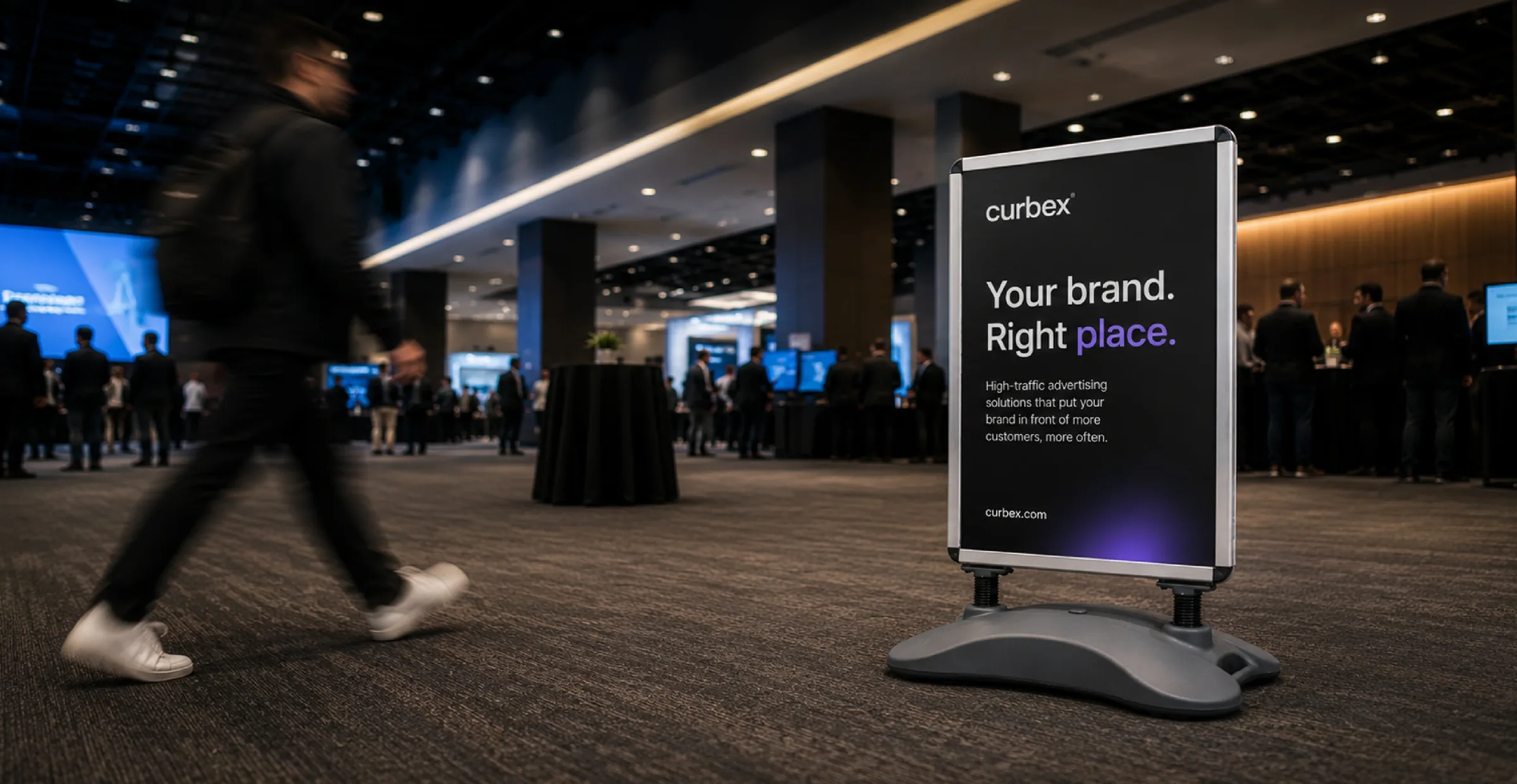 Curbex event advertising sign in a busy conference space