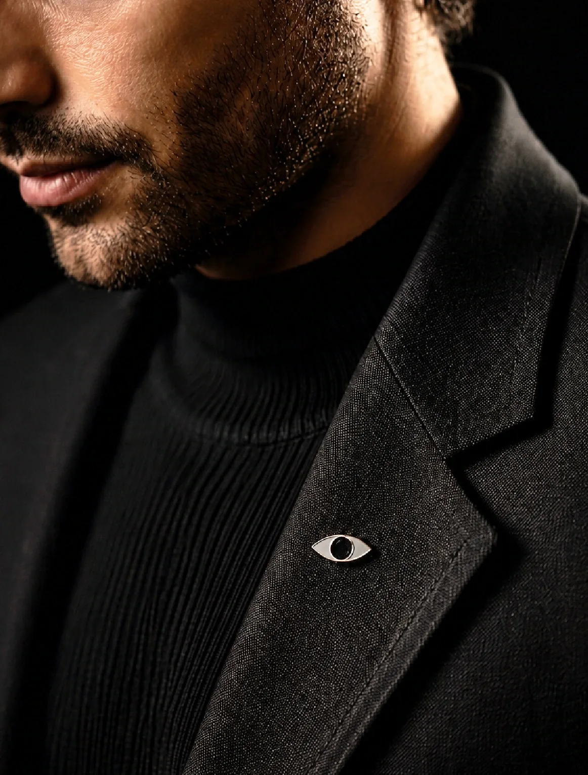 PILBAN eye pin on black jacket